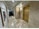 Hallway with artwork, tiled floor, and elevator access at 7151 E Rancho Vista Dr # 4001, Scottsdale, AZ 85251
