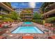 Relaxing community hot tub surrounded by lounge chairs and lush landscaping at 7151 E Rancho Vista Dr # 4001, Scottsdale, AZ 85251