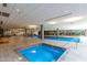 Indoor hot tub and pool with lounge chairs and modern amenities at 7151 E Rancho Vista Dr # 4001, Scottsdale, AZ 85251