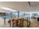Indoor pool area with seating, lounge chairs, and a view of the gym at 7151 E Rancho Vista Dr # 4001, Scottsdale, AZ 85251