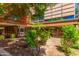 Landscaped courtyard with plants, trees, and building in background at 7151 E Rancho Vista Dr # 4001, Scottsdale, AZ 85251