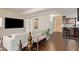 Living room with a white couch, large TV, and view of the kitchen and bathroom at 7151 E Rancho Vista Dr # 4001, Scottsdale, AZ 85251