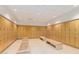 Well-lit locker room with rows of wooden lockers and benches at 7151 E Rancho Vista Dr # 4001, Scottsdale, AZ 85251