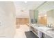 Spacious locker room with wooden lockers, benches, and modern sinks at 7151 E Rancho Vista Dr # 4001, Scottsdale, AZ 85251