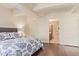 Main bedroom with ceiling fan, dark wood floors, and an ensuite bathroom at 7151 E Rancho Vista Dr # 4001, Scottsdale, AZ 85251