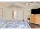 Main bedroom with ceiling fan, plush carpeting, and dresser at 7151 E Rancho Vista Dr # 4001, Scottsdale, AZ 85251