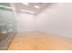 Indoor racquetball court with hardwood floors and glass walls at 7151 E Rancho Vista Dr # 4001, Scottsdale, AZ 85251