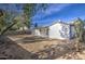 Backyard with covered patio, fire pit, and mature trees at 7431 W Ocotillo Rd, Glendale, AZ 85303