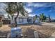 Front view of a single-story home with a driveway, attached garage, and desert landscaping at 7431 W Ocotillo Rd, Glendale, AZ 85303