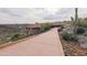 Long driveway leading up to a modern desert home with scenic views at 8702 E Silver Saddle Dr, Carefree, AZ 85377