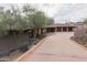 Modern desert home with a three-car garage and unique landscaping at 8702 E Silver Saddle Dr, Carefree, AZ 85377