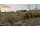 Desert home nestled among cacti and native plants at 8702 E Silver Saddle Dr, Carefree, AZ 85377
