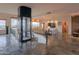 Modern living room with an elevator, large windows, and desert views at 8702 E Silver Saddle Dr, Carefree, AZ 85377