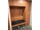 Mudroom with wooden bench, hooks, and storage at 8702 E Silver Saddle Dr, Carefree, AZ 85377