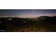Stunning panoramic night view from a desert hillside property at 8702 E Silver Saddle Dr, Carefree, AZ 85377