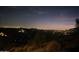 Breathtaking night view of the city lights from a hillside home at 8702 E Silver Saddle Dr, Carefree, AZ 85377