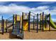 Community playground with slides, climbing structures, and a soft ground covering at 10127 S 57Th Dr, Laveen, AZ 85339