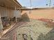 Small backyard patio with seating area, and a brick wall at 10502 W Hutton Dr, Sun City, AZ 85351