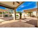 Relaxing backyard oasis with pergola, pool, and water feature at 13992 W Maui Ln, Surprise, AZ 85379