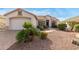 Inviting single-story home with a well-maintained front yard and desert landscaping at 17907 W Udall Dr, Surprise, AZ 85374