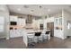 Modern kitchen with white cabinets, stainless steel appliances, and a large island at 20568 W Oregon Ave, Buckeye, AZ 85396