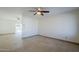 Open living space with tile floors and access to patio at 2201 W Wickieup Ln, Phoenix, AZ 85027