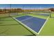 Pickleball courts with green surfacing and surrounding fencing at 25159 N 174Th Ave, Surprise, AZ 85387