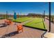 Community bocce ball courts with turf, string lights, and seating at 25347 N 176Th Ave, Surprise, AZ 85387