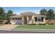 Exterior of a single-story home with a tile roof, white garage door, and landscaped yard at 25347 N 176Th Ave, Surprise, AZ 85387