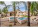 Backyard with pool, lush landscaping, and palm trees at 26435 N 44Th Way, Phoenix, AZ 85050