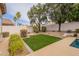 Lush green lawn with surrounding landscaping and a block wall at 26435 N 44Th Way, Phoenix, AZ 85050