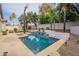 Tranquil pool with water feature, surrounded by lush landscaping and lighting at 26435 N 44Th Way, Phoenix, AZ 85050