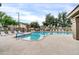 Inviting community pool with lounge chairs and shade trees at 2727 N Price Rd # 6, Chandler, AZ 85224