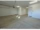 Spacious garage with white walls and door opener at 31491 N Wet Creek Rd, San Tan Valley, AZ 85143