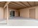 Covered patio with sliding glass door and access to backyard at 5620 N 71St Ave, Glendale, AZ 85303