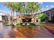 Outdoor stone fireplace with seating area in a plaza setting at 5807 E Rose Garden Ln, Phoenix, AZ 85054