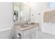 Clean bathroom with white vanity, mirror, and beige countertop at 6424 E Dallas St, Mesa, AZ 85205