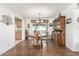 Dining area with wood flooring, chandelier, and large hutch at 6424 E Dallas St, Mesa, AZ 85205