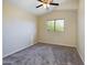 Bedroom with gray carpet and a ceiling fan at 8022 S 48Th Dr Dr, Laveen, AZ 85339