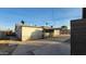 Back view of a house with a covered patio and driveway at 8220 N 35Th Ave, Phoenix, AZ 85051