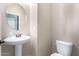 Clean and updated half bathroom with pedestal sink and toilet at 9982 W Villa Chula --, Peoria, AZ 85383