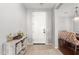 Bright and airy foyer with a console table and view of dining area at 9982 W Villa Chula --, Peoria, AZ 85383