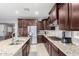 Well-equipped kitchen features granite countertops and stainless steel appliances at 9982 W Villa Chula --, Peoria, AZ 85383