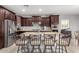 Spacious kitchen boasts granite countertops and dark wood cabinetry at 9982 W Villa Chula --, Peoria, AZ 85383