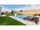 Relaxing backyard pool with patio furniture and lush grass at 9982 W Villa Chula --, Peoria, AZ 85383