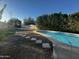 Swimming pool with stepping stones and lush green bushes at 11808 N 111Th Way, Scottsdale, AZ 85259