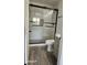 Bathroom with gray vanity, frameless shower, and wood-look flooring at 1231 E Marco Polo Rd, Phoenix, AZ 85024