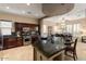 Open-concept kitchen with granite countertops, pendant lights, and stainless steel appliances at 12350 W Bajada Rd, Peoria, AZ 85383