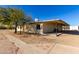 Backyard of a home with a covered patio and desert landscaping at 1430 W Maddock Rd, Phoenix, AZ 85086