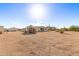 Wide view of a spacious gravel backyard with sheds at 1430 W Maddock Rd, Phoenix, AZ 85086